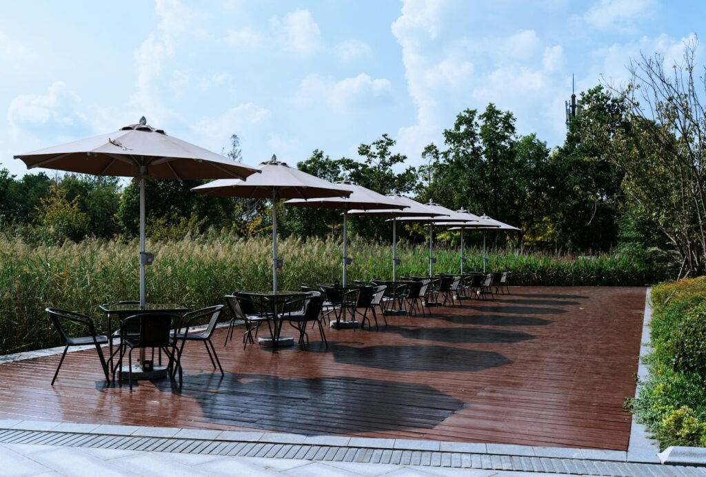 Outdoor cafe seating with umbrellas and tables